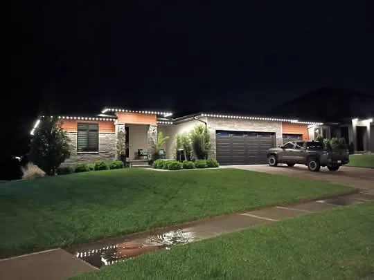 Home exterior lit by installed LED lighting at night