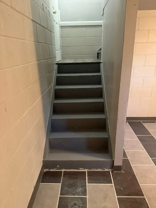 Tiled stairway landing and hallway floor